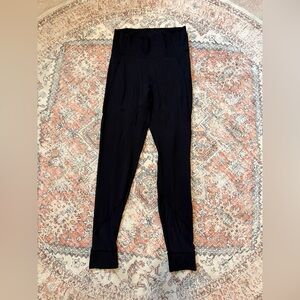 Black lululemon leggings with sheer lining on legs